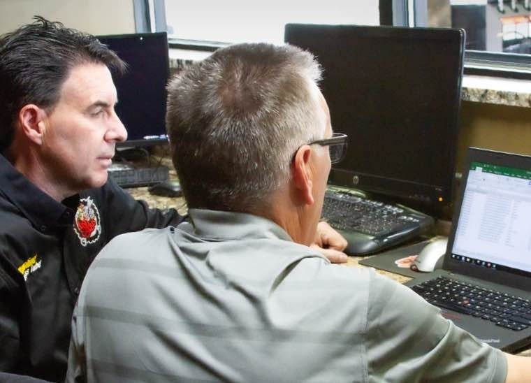 Men working on computer