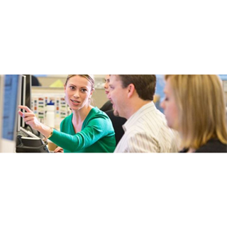 Men and women in front of computer screen